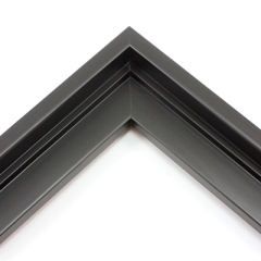 This stair step wood floater frame has a matte black finish with a steep upper and small lower step. The canvas will hover neatly within the simple, modern border. 

Give an authentic, fine art display to your favourite Giclée print or oil painting. This size is ideal for thin (3/4 " deep) gallery wrap canvases. The canvas may protrude slightly above the frame face. 

*Note: These solid wood, custom canvas floaters are for stretched canvas prints and paintings, and raised wood panels.
