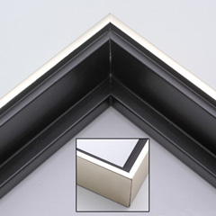 This solid wood canvas floater picture frame features a shiny brushed silver on the outside edge and narrow face.  The long inside step and base are a matte black. 

Display your favourite gallery wrapped canvas Giclée print or oil painting with authentic, fine art style. This canvas floating frame is ideal for large, thich (1.5 " deep) canvas images.

*Note: These canvas floaters are for stretched canvas prints and paintings, and raised wood panels.